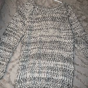 grey and white sweater with black bows